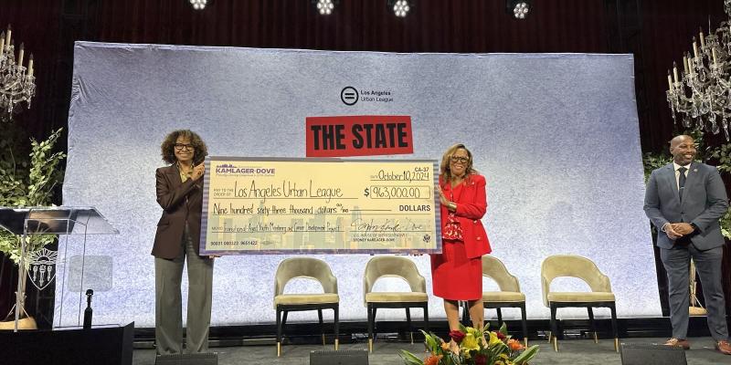 Congresswoman Kamlager-Dove presents a check for $963,000 to the Los Angeles Urban League at its State of Black LA event on Thursday.
